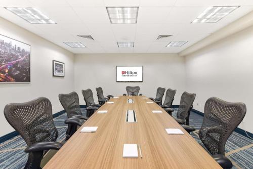 a conference room with a long table and chairs at Hilton Garden Inn LAX - El Segundo in El Segundo