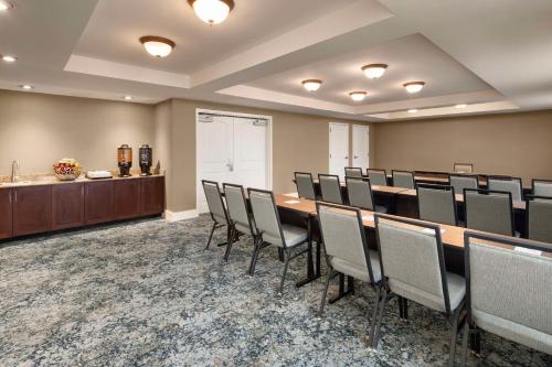 a conference room with a long table and chairs at Homewood Suites by Hilton Wallingford-Meriden in Wallingford
