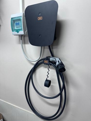 a computer with a hose hooked up to a wall at Villa Rose & SPA in Mežciems