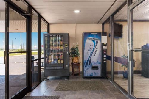a drink vending machine in a building with windows at Econo Lodge High Point - Archdale in High Point