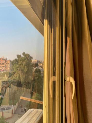 a window with a view of a city at Unique Pyramids Boutique INN in Cairo
