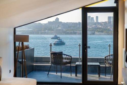 a balcony with a view of the water and a boat at 216 Bosphorus in Istanbul