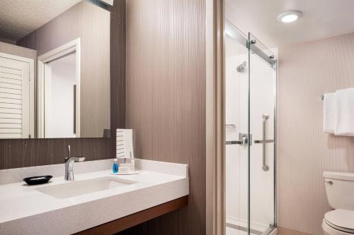 a bathroom with a sink and a shower at Courtyard San Jose Cupertino in Cupertino