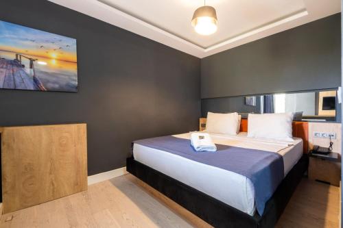 a bedroom with a bed and a tv on the wall at 216 Bosphorus in Istanbul