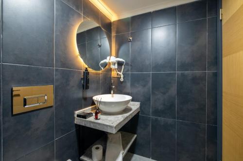 a bathroom with a sink and a mirror at 216 Bosphorus in Istanbul