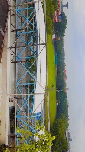 a building under construction with a blue scaffolding at Hotel Moon Chanakyapuri Satya Niketan- Couple Friendly in New Delhi