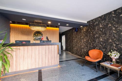 a hotel lobby with a bar and a chair at 216 Bosphorus in Istanbul