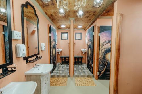 a bathroom with a sink and a mirror at Peace Haven @ Windfarm Accommodation in Yzerfontein