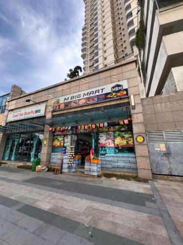 a building with a vegetable market on a street at Cozy Beachfront Seaview with 2 CarParks FOC Netflix Access and YouTube Premium 3Beds3Bath 6-11pax by Minshuku in Johor Bahru