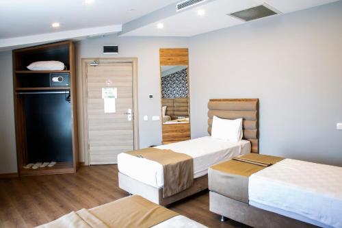 Postel nebo postele na pokoji v ubytování King City Hotel Istanbul Ataturk Airport