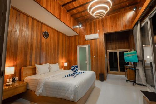 Giường trong phòng chung tại Dijobi Villa Bali