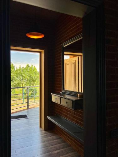 a room with a window and a view of a porch at Dad Residence in Lankaran