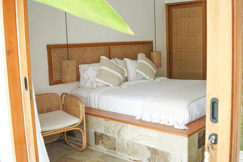 Postel nebo postele na pokoji v ubytování Villa Mimpi - Bela Sulu Villas