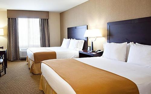 a hotel room with two beds and a window at Blue Way Inn Eagan Extended Stay in Eagan