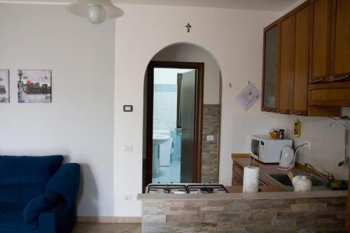 a kitchen with a stove top oven in a room at House 39 in Capranica