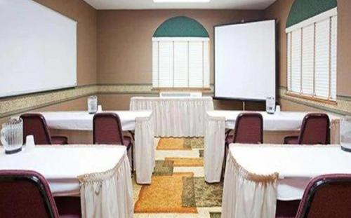 a conference room with tables and chairs in it at Blue Way Inn Eagan Extended Stay in Eagan