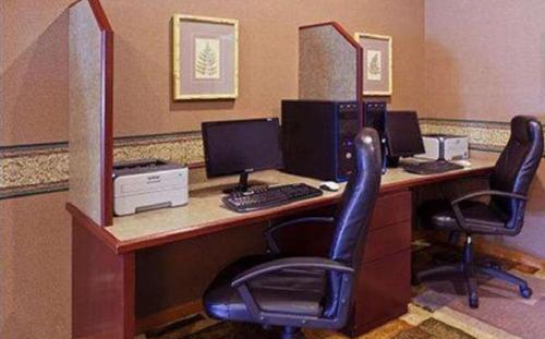 an office with a desk with two computers and two chairs at Blue Way Inn Eagan Extended Stay in Eagan