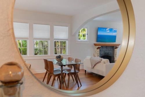 a dining room with a table and a living room at Relax in Hacienda de Paradise in SoSo West Palm Beach in Cloud Lake