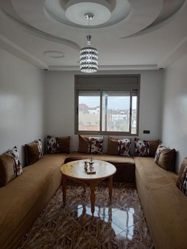 Coin salon dans l'établissement Appartement Hajar