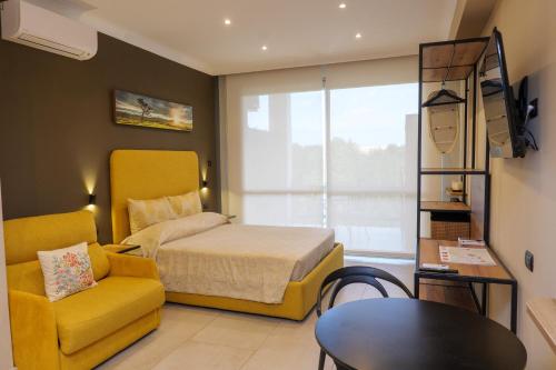 a bedroom with a bed and a chair and a table at Domus Aurelia in Rome
