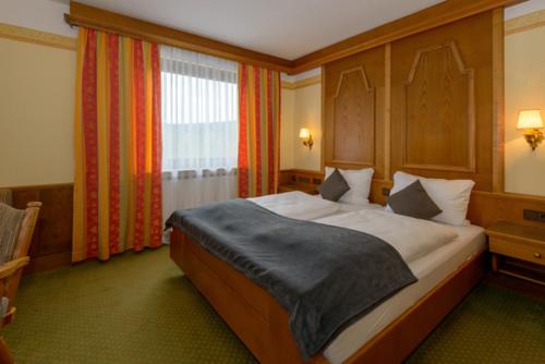 Postel nebo postele na pokoji v ubytování Hotel Kurpark