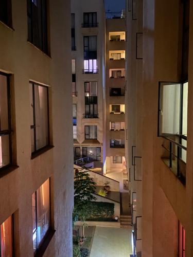 an aerial view of an apartment building at night at Feel Home -One bedroom with swimming pool in Kiambu