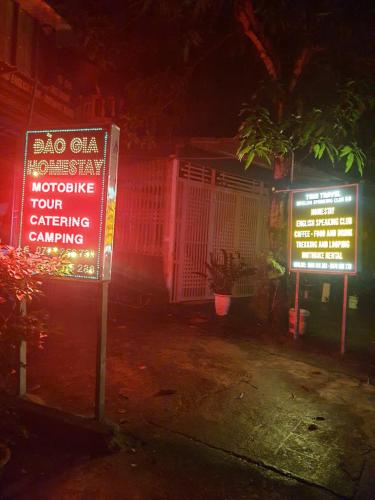 a sign in front of a building at night at Time Travel - Ha Giang Loop Tour in Ha Giang