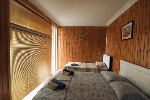 Ein Bett oder Betten in einem Zimmer der Unterkunft Magnito