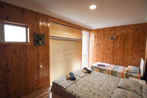 Ein Bett oder Betten in einem Zimmer der Unterkunft Magnito
