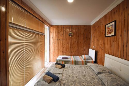 Ein Bett oder Betten in einem Zimmer der Unterkunft Magnito