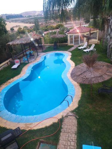 an overhead view of a swimming pool in a yard at Villa Anas in Sale