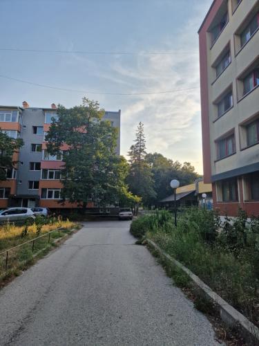an empty street in a city with a building at Apart Harmony in Ruse