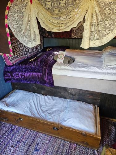 two bunk beds in a room with a curtain at Grand Circus Hotel in Malmö