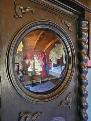 a mirror with a reflection of a room at Grand Circus Hotel in Malmö