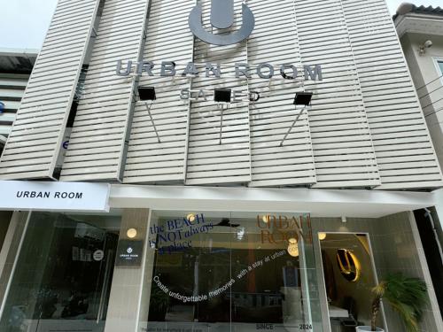 a store front of a building with a sign on it at Urban room samed in Ko Samed