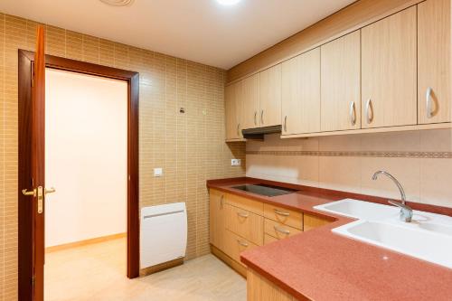 a kitchen with a sink and a counter top at Apartamento Confort Valderrobres in Valderrobres