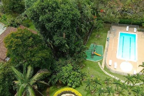an aerial view of a yard with a swimming pool at City views Air-conditioning Heated pool in Envigado
