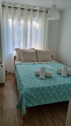 a bed with two pillows on it in a bedroom at Panonski raj in Palić