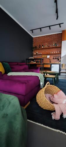 a room with a bed and a couch and a table at Oldtown Prishtina Apartments in Pristina