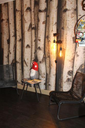 a stuffed bird sitting on a table in a room at Label Semois Gite rural 3 épis in Bouillon