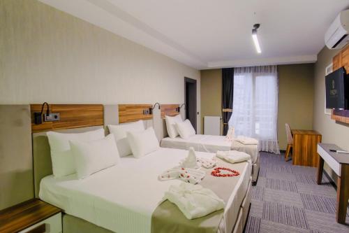 Una cama o camas en una habitación de Pereira Samsun
