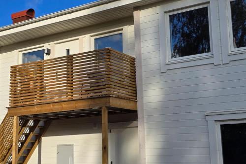 a deck on the side of a house at Nybyggd lägenhet i Vimmerby in Vimmerby