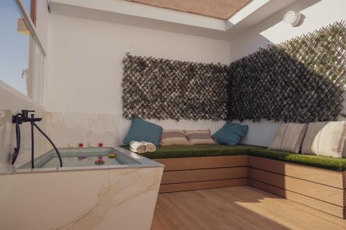 a bathroom with a tub and a sink and a shower at Apartamento Urbano Granada in Granada