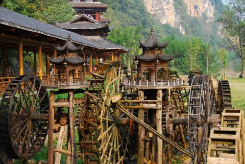 an amusement park with a bunch of wooden structures at 张家界东篱山居民宿- Free pick up service in Zhangjiajie
