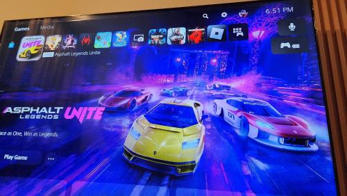 a display of four cars in a racing game at K-Avenue with PS5 and Pool View by JH Project in Kampong Tangihan