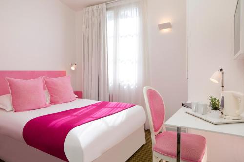 Cama o camas de una habitación en Hôtel Mistral