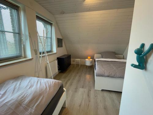 Postel nebo postele na pokoji v ubytování Ferienhaus Nordseeperle