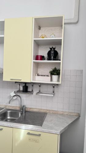 a kitchen with a sink and a counter top at Sawasdee 37 in Monza