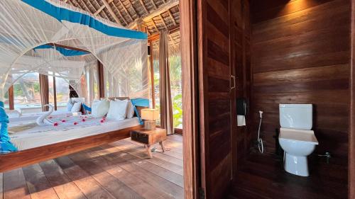 Voodi või voodid majutusasutuse TIKI Beach Club & Resort toas