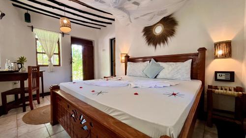 Voodi või voodid majutusasutuse TIKI Beach Club & Resort toas